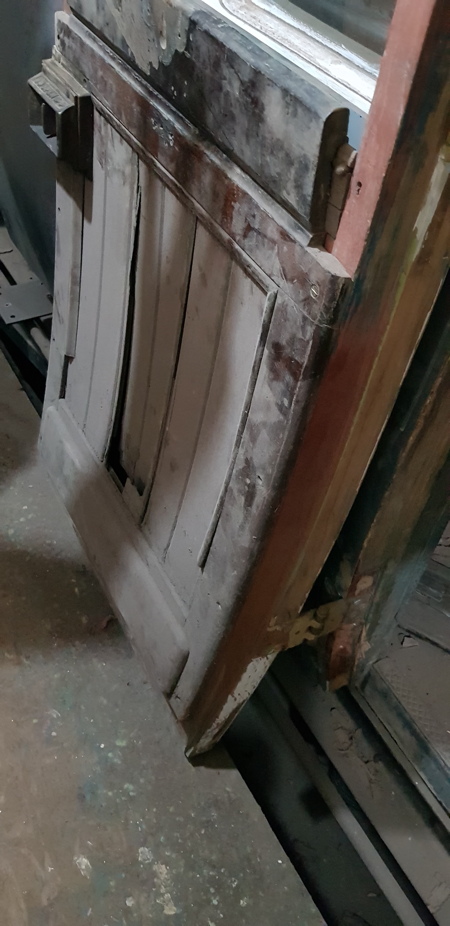 old damaged panelling on inside of door